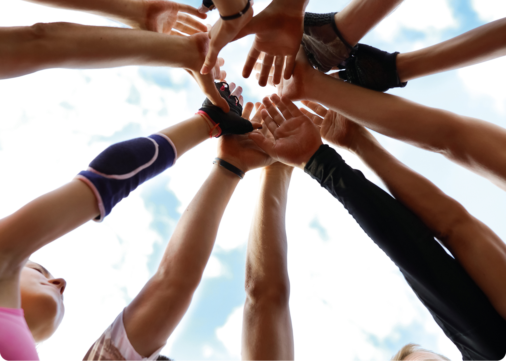 cropped-shot-women-putting-hands-together-circle-3-(3)